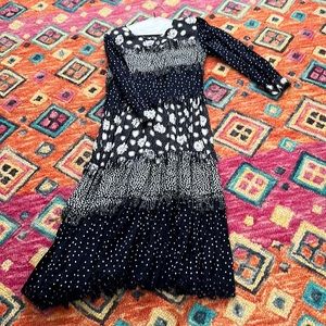 Passports of Pier 1 imports women’s dress size medium made in India.